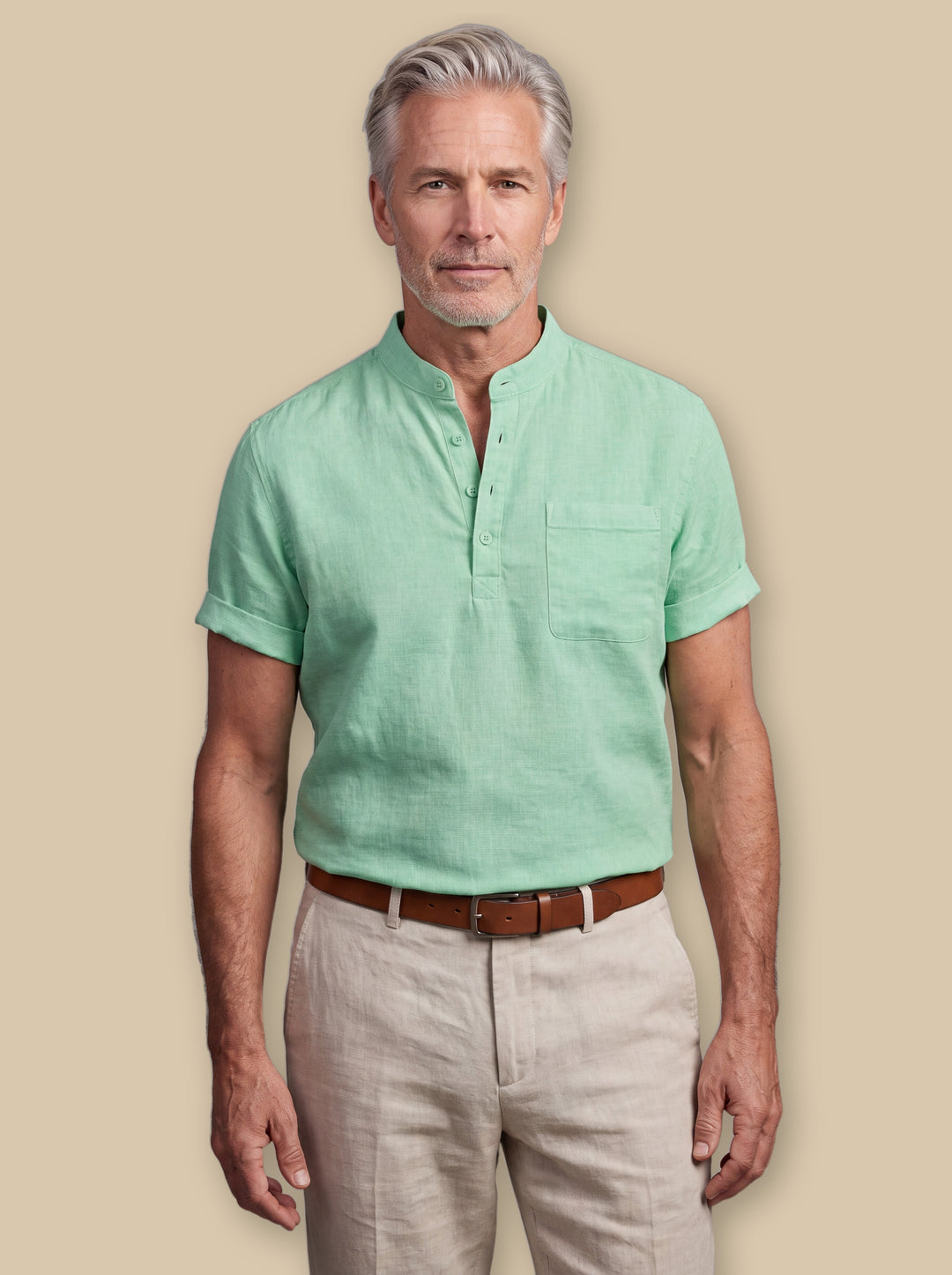 Abraham linen shirt in Green, worn by a model on a warm sand studio background - Gentlemens Manor