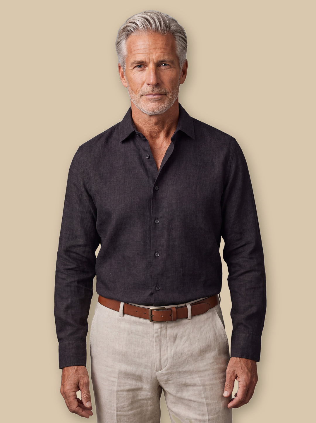 Alden linen shirt in Black, worn by a model on a warm sand studio background - Gentlemens Manor