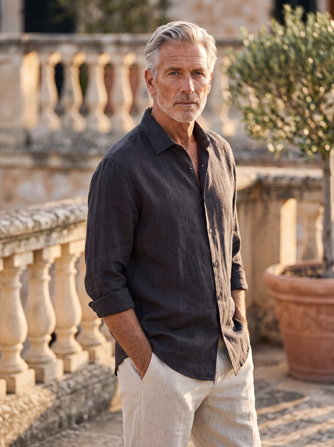 Alden Men linen shirt in black, worn by a model on a Mediterranean terrace - Gentlemens Manor lifestyle
