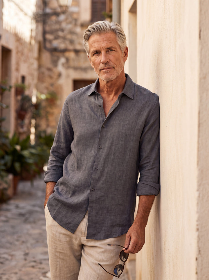 Alden Men linen shirt in Grey, worn by a model on a Mediterranean terrace - Gentlemens Manor lifestyle