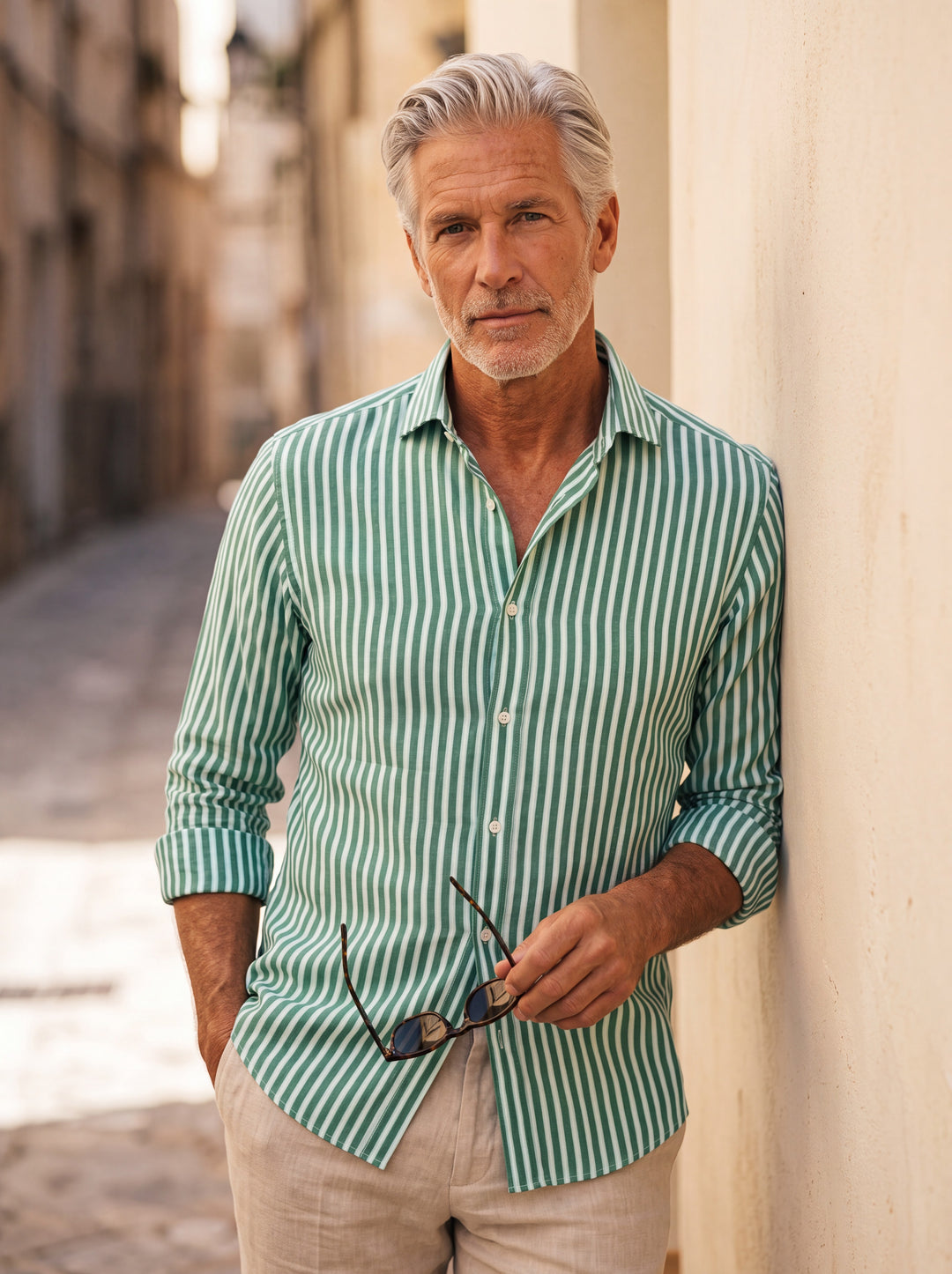 Alfred Men linen shirt in Light Blue, worn by a model on a Mediterranean terrace - Gentlemens Manor lifestyle