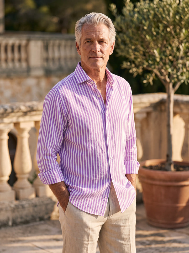 Alfred Men linen shirt in Purple, worn by a model on a Mediterranean terrace - Gentlemens Manor lifestyle