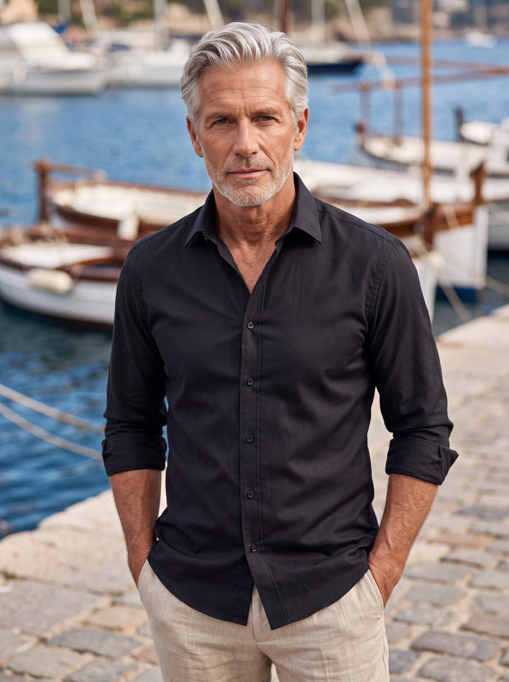 Alvin shirt in Black, worn by a model in a Mediterranean setting - Gentlemens Manor lifestyle