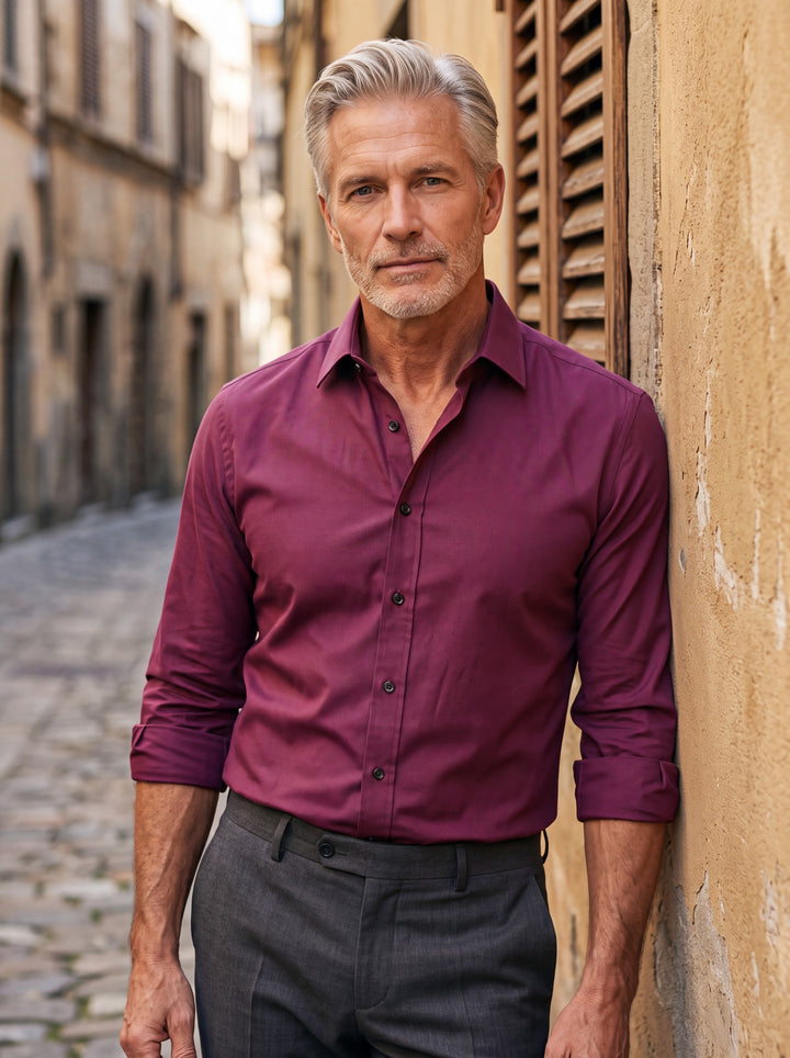 Alvin shirt in Burgundy, worn by a model in a Mediterranean setting - Gentlemens Manor lifestyle