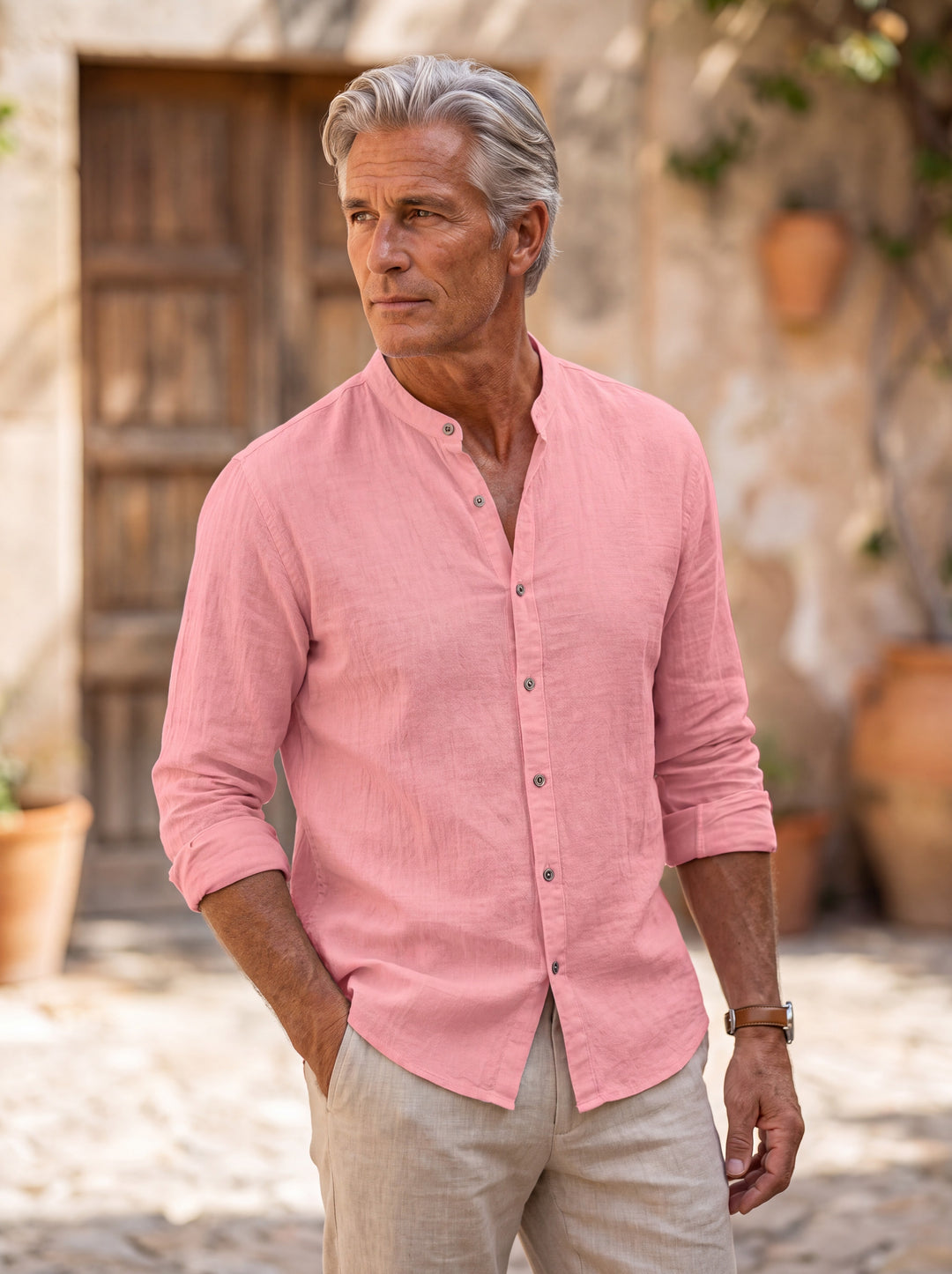 Amos Men linen shirt in Pink, worn by a model on a Mediterranean terrace - Gentlemens Manor lifestyle