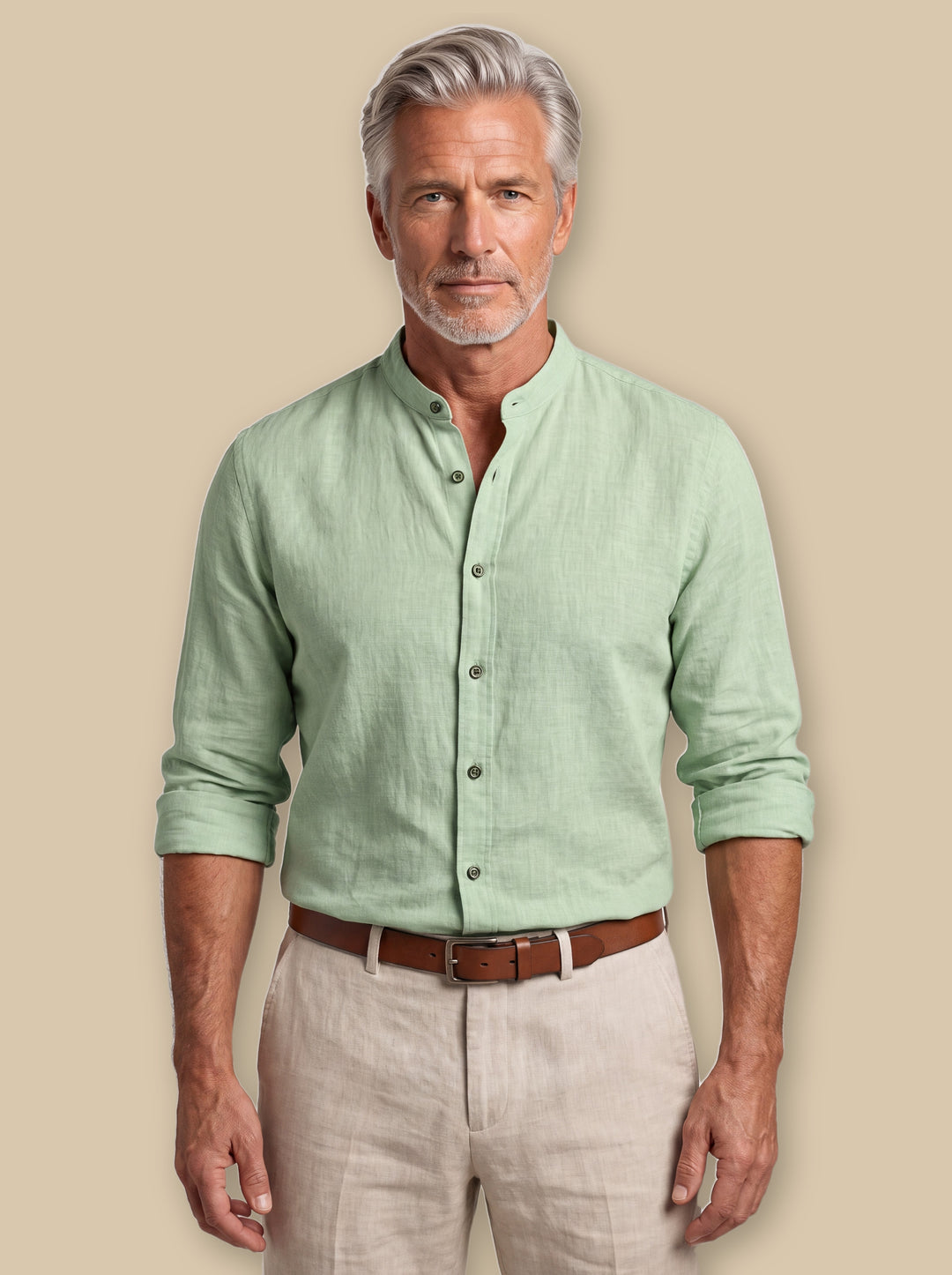 Amos linen shirt in Sage, worn by a model on a warm sand studio background - Gentlemens Manor