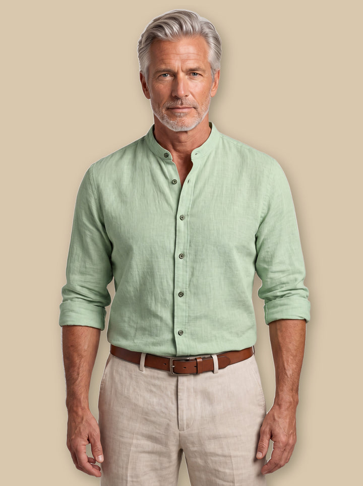 Amos linen shirt in Sage, worn by a model on a warm sand studio background - Gentlemens Manor