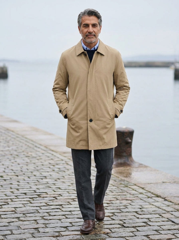 Ansel quilted lined car coat in Sand, lifestyle on a stone harbor quay, Gentlemens Manor