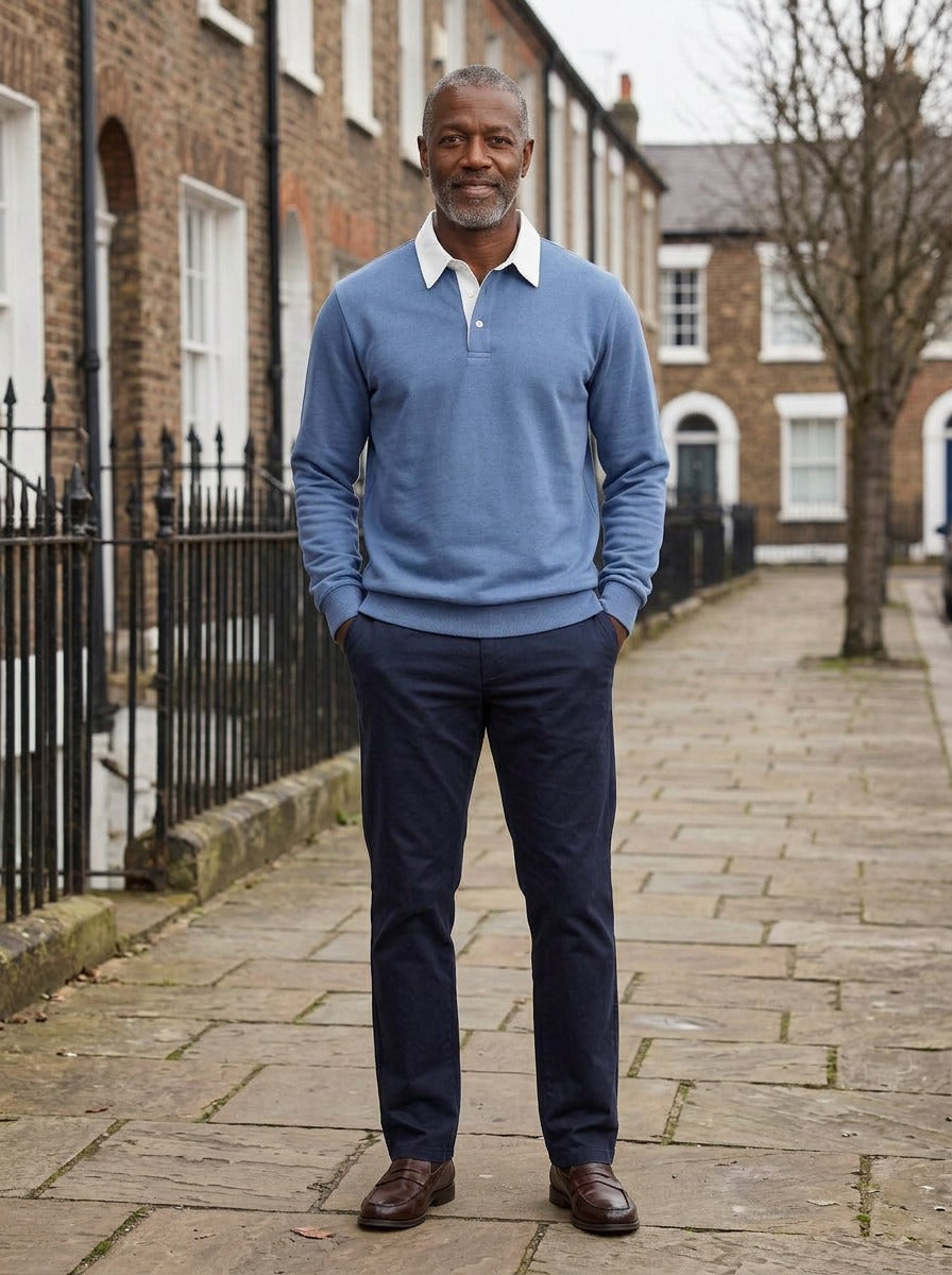 Ashbury polo in Blue, lifestyle on a street of brick row houses, Gentlemens Manor