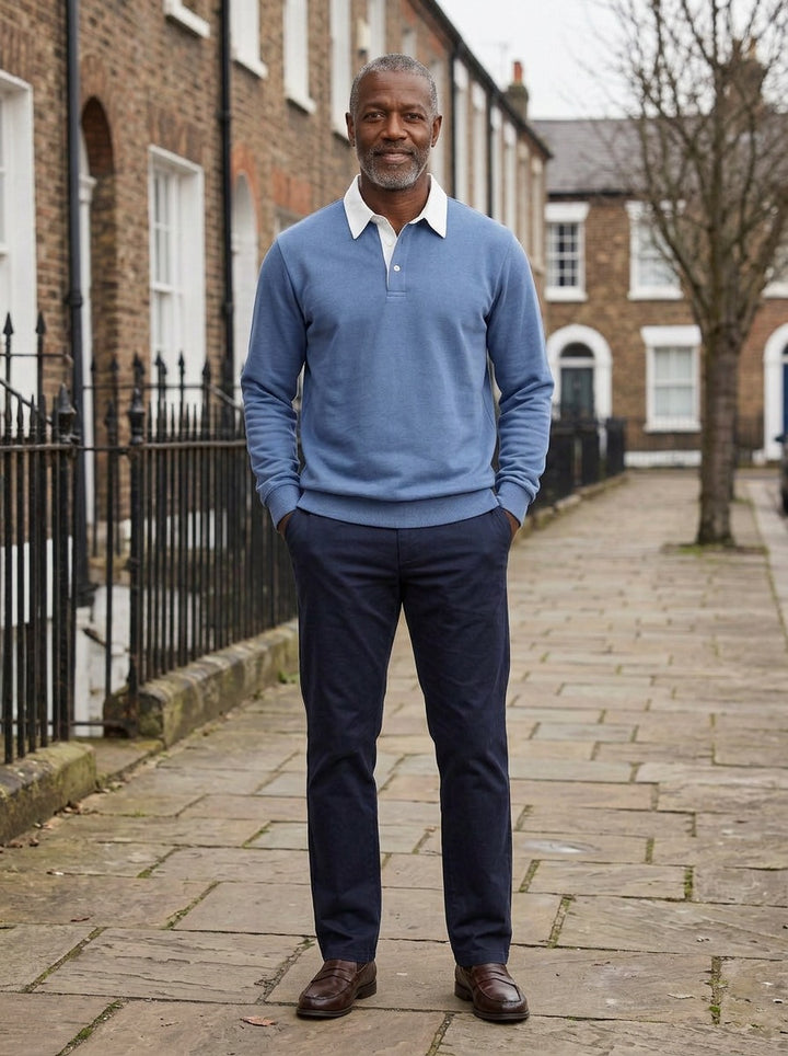 Ashbury polo in Blue, lifestyle on a street of brick row houses, Gentlemens Manor