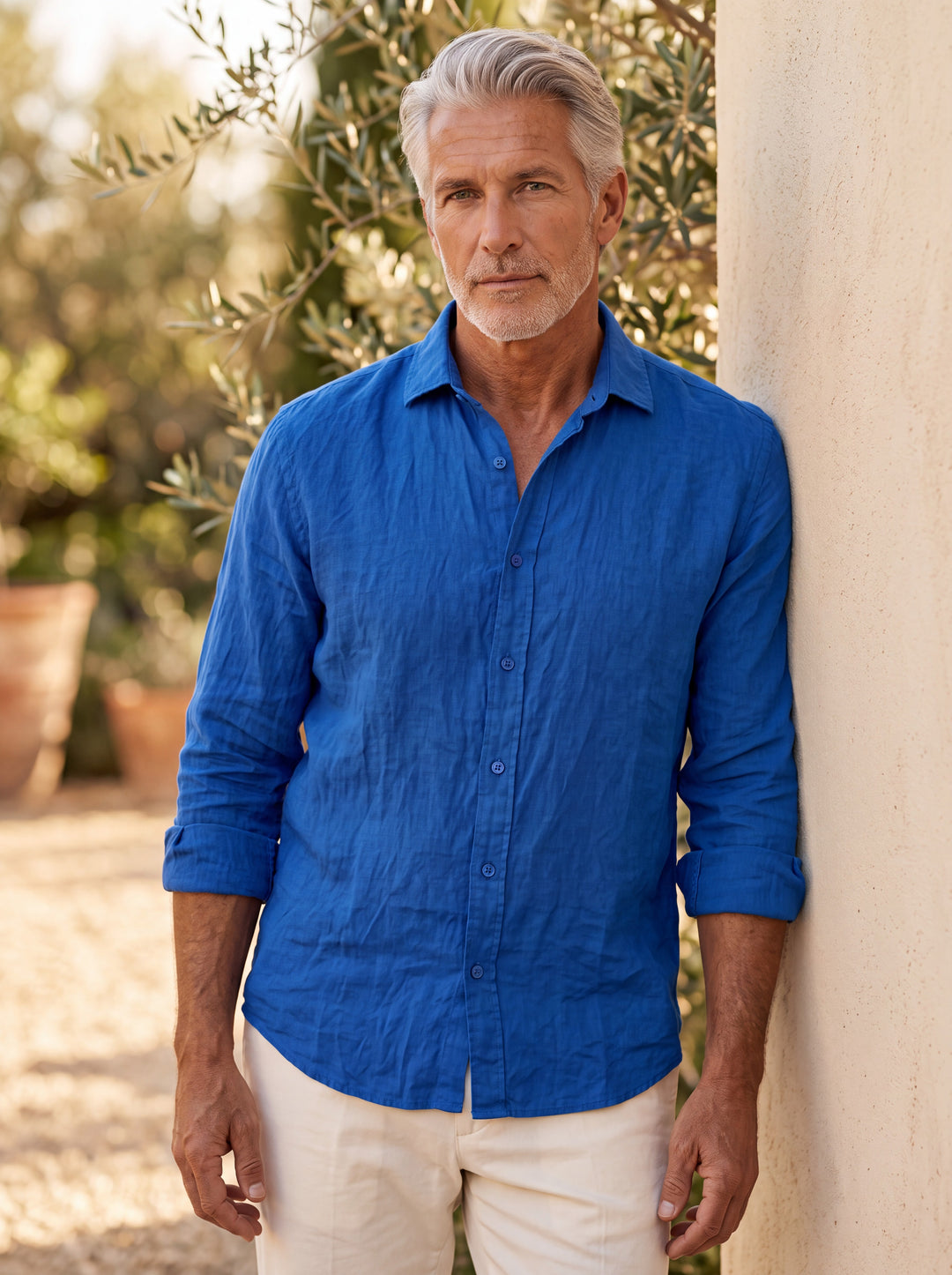 Atticus shirt in Blue, worn by a model in a Mediterranean setting - Gentlemens Manor lifestyle