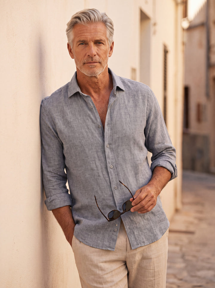 Austin Men linen shirt in Grey, worn by a model on a Mediterranean terrace - Gentlemens Manor lifestyle