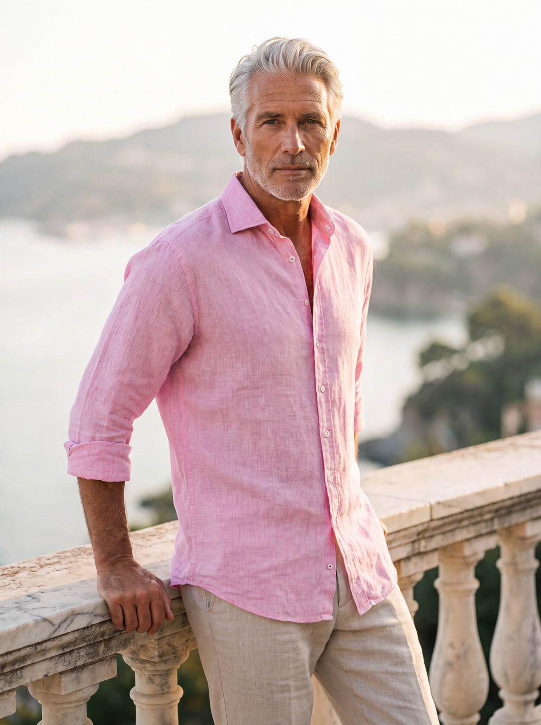 Austin Men linen shirt in pink, worn by a model on a Mediterranean terrace - Gentlemens Manor lifestyle