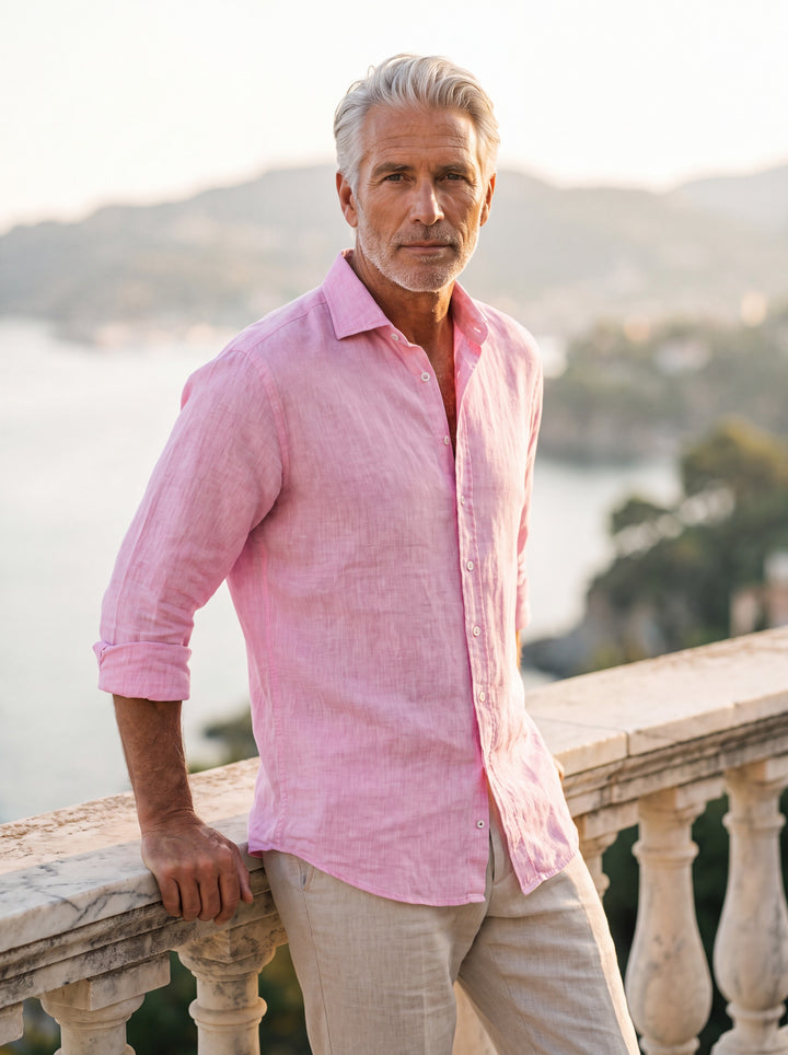 Austin Men linen shirt in pink, worn by a model on a Mediterranean terrace - Gentlemens Manor lifestyle