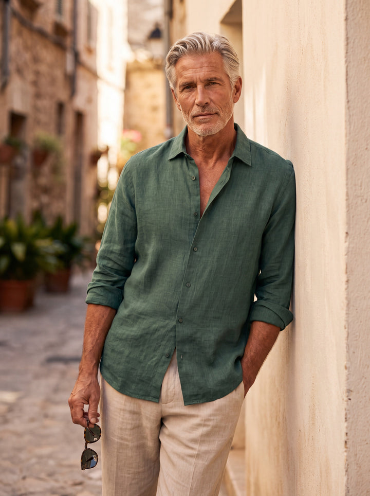 Avery Men linen shirt in green, worn by a model on a Mediterranean terrace - Gentlemens Manor lifestyle