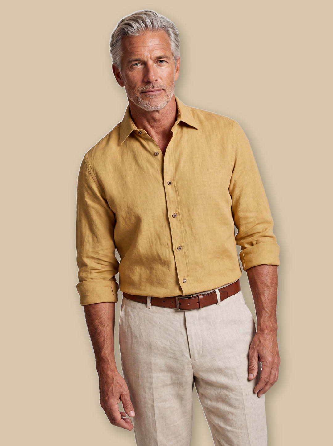Axel linen shirt in Mustard, worn by a model on a warm sand studio background - Gentlemens Manor