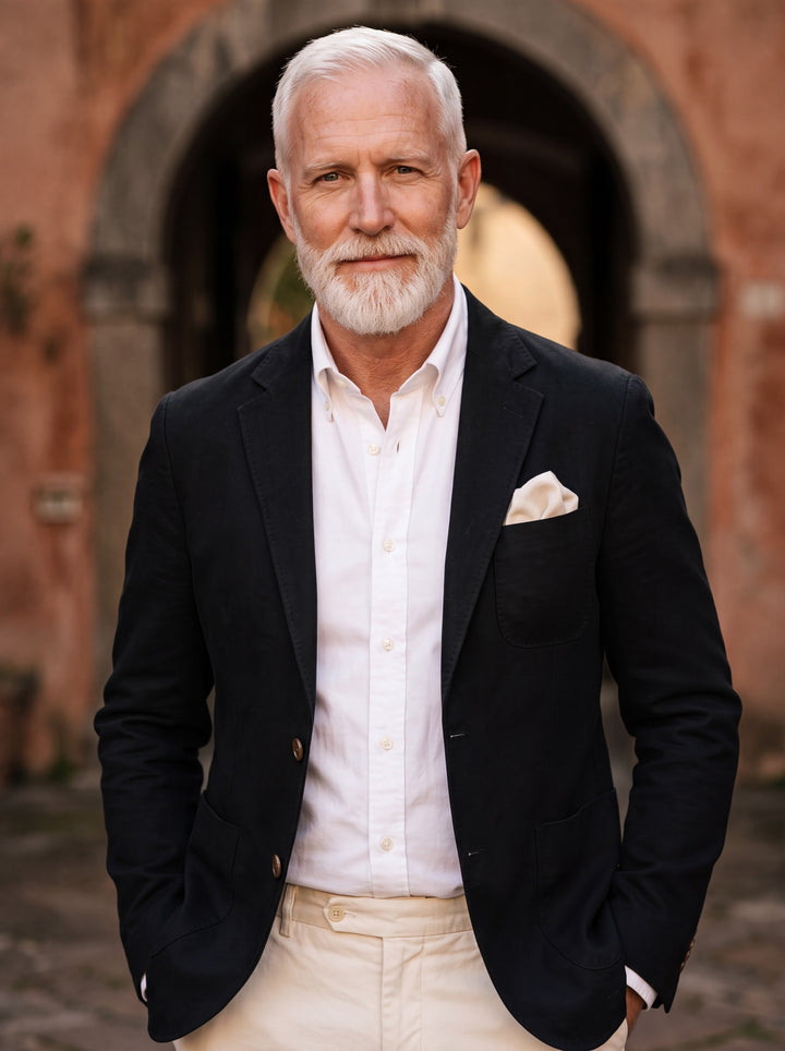 Baldwin blazer in Black, worn by a model in a Mediterranean setting - Gentlemens Manor lifestyle