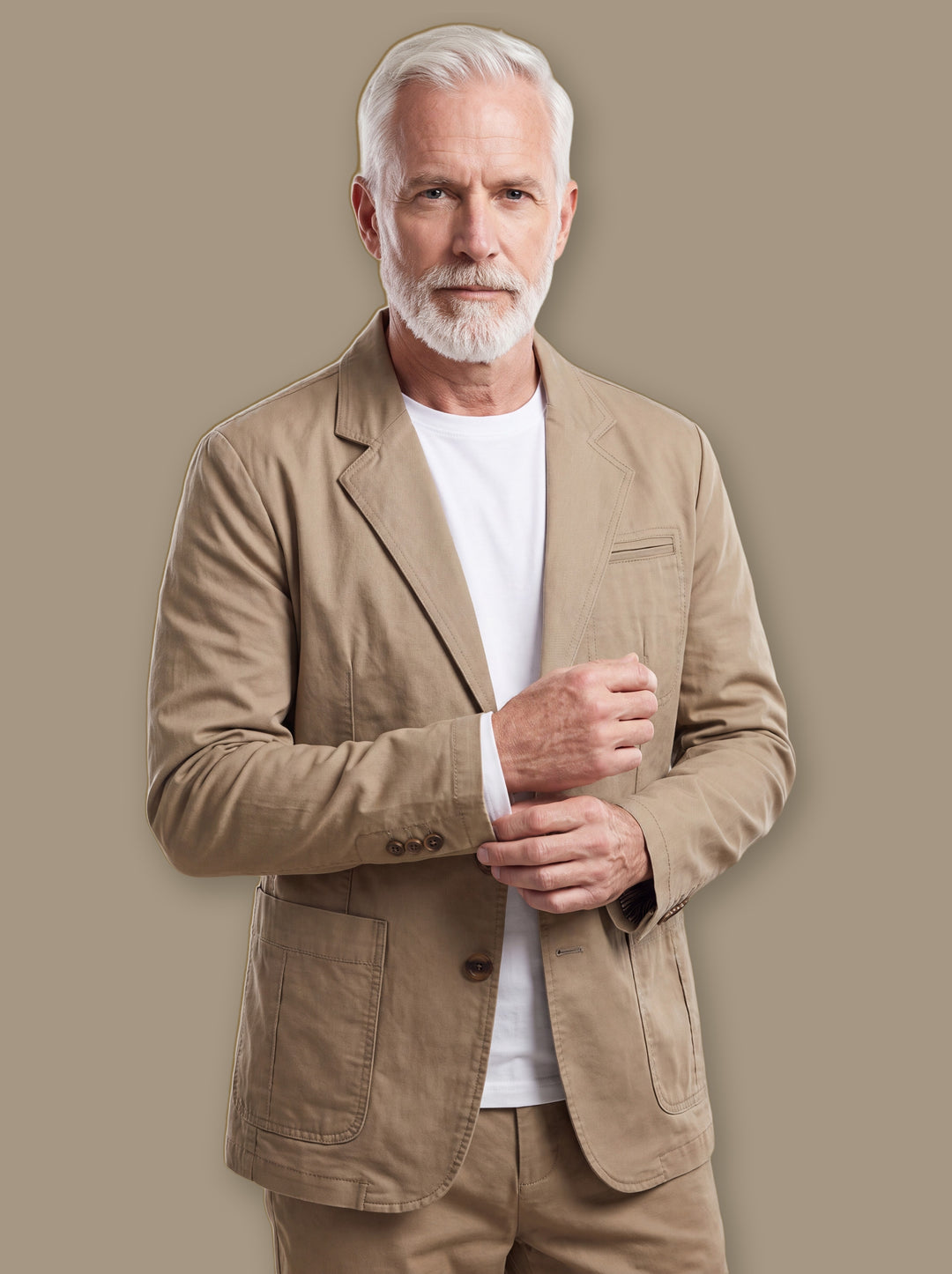 Baldwin blazer suit in Sand, worn by a model on a warm taupe studio background - Gentlemens Manor