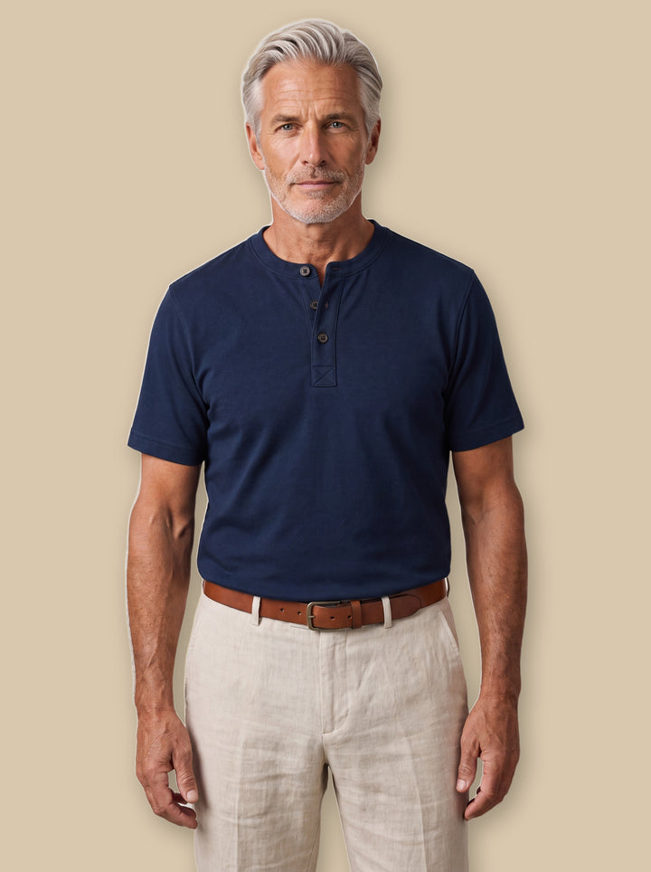 Baldwin casual shirt in Navy, worn by a model on a warm sand studio background - Gentlemens Manor