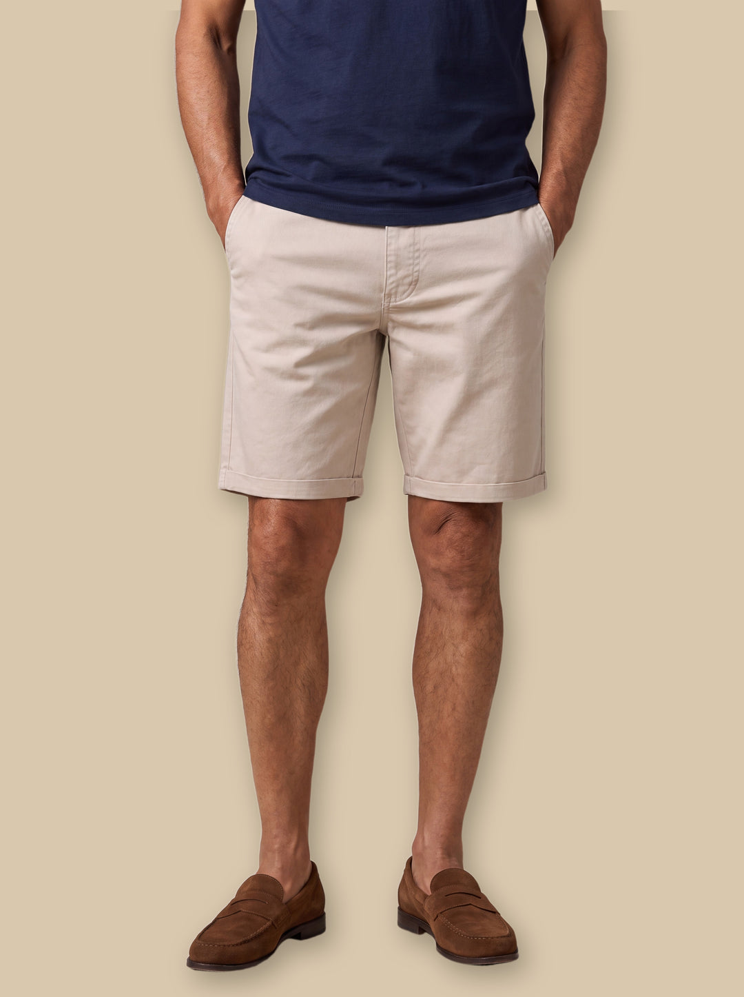 Barclay summer shorts in Sand, worn by a model on a warm sand studio background - Gentlemens Manor