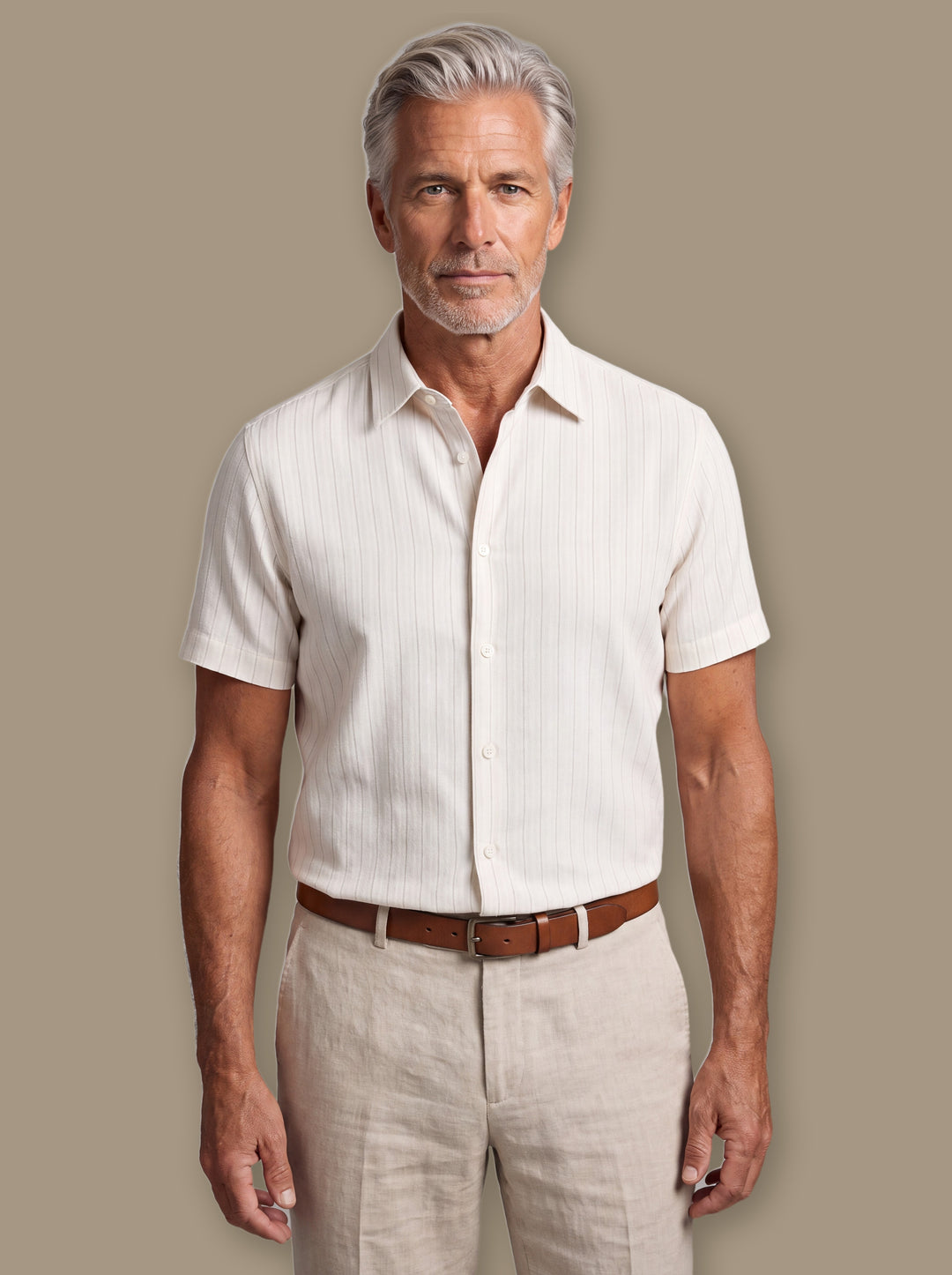Barnaby linen shirt in White, worn by a model on a warm taupe studio background - Gentlemens Manor