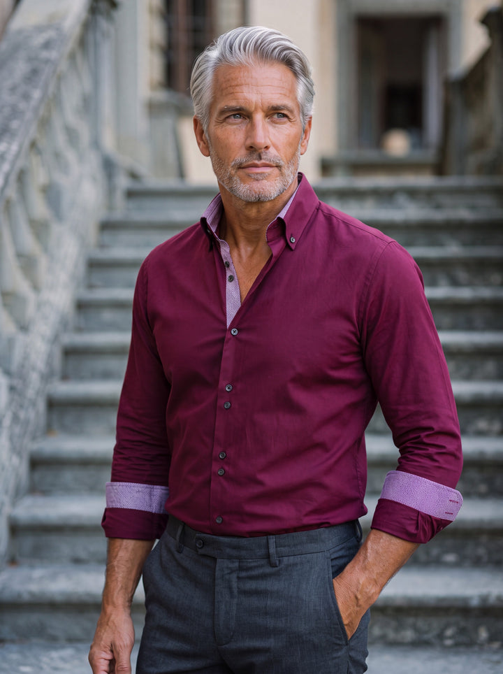 Barrett shirt in Burgundy, worn by a model in a Mediterranean setting - Gentlemens Manor lifestyle