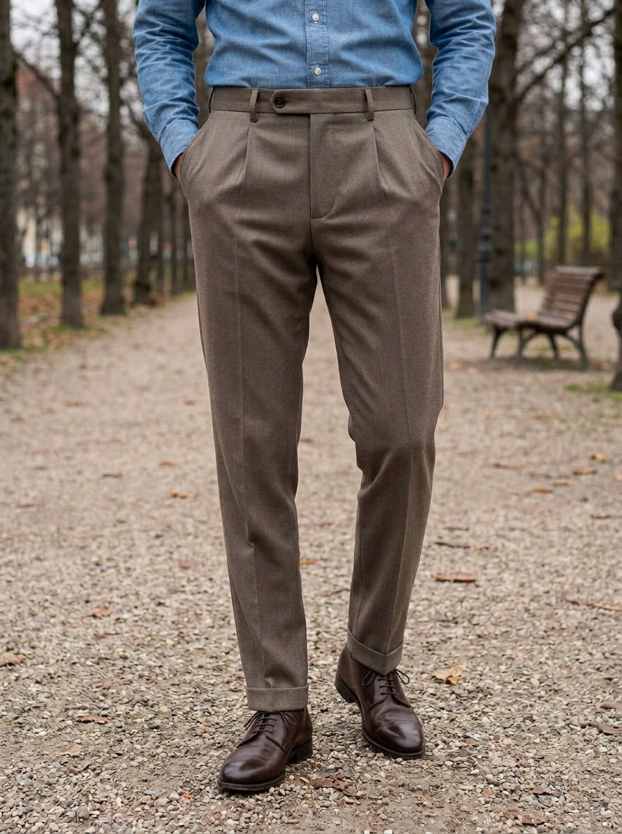 Benton slim tapered pleated trousers in Brown, lifestyle on a park path, Gentlemens Manor