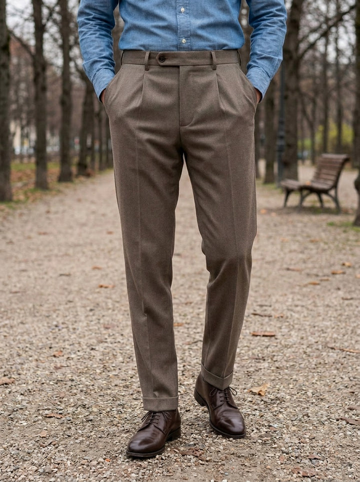 Benton slim tapered pleated trousers in Brown, lifestyle on a park path, Gentlemens Manor