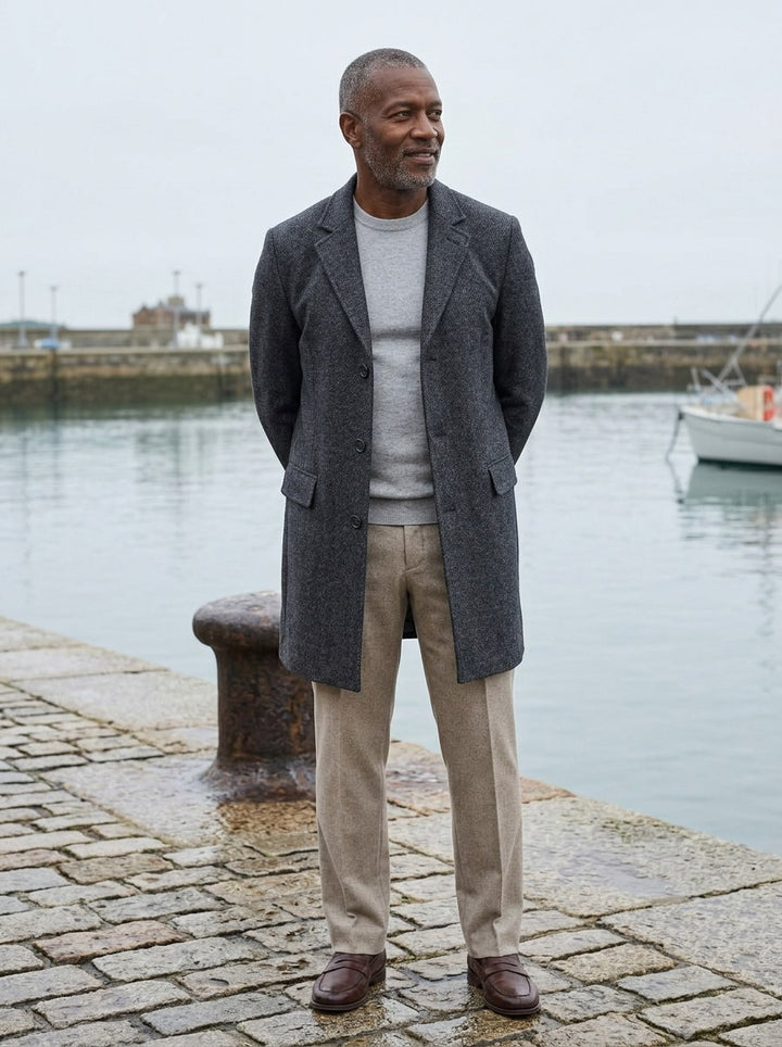 Beresford overcoat in Charcoal, lifestyle on a stone harbor quay, Gentlemens Manor