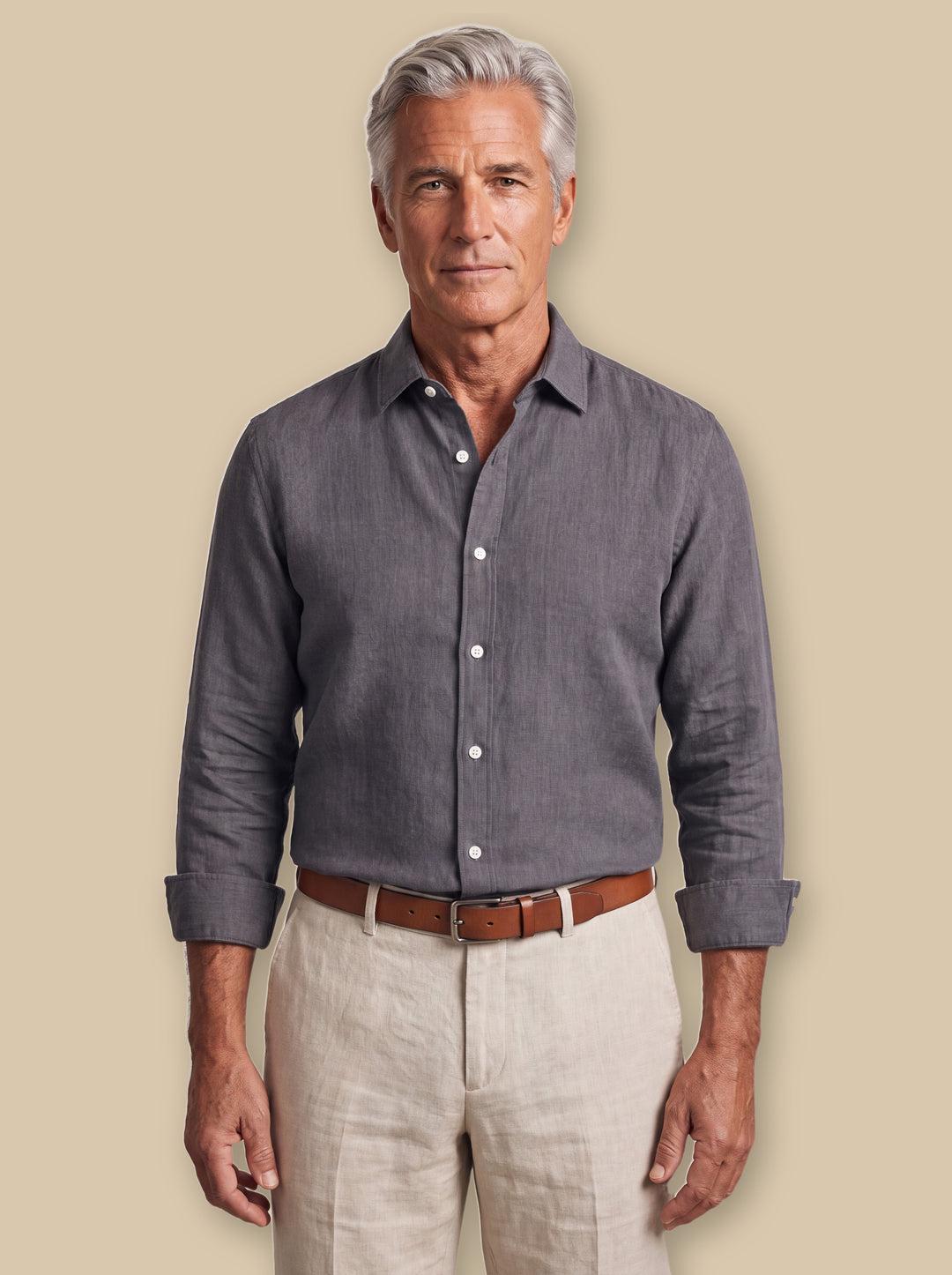 Bernard linen shirt in Charcoal, worn by a model on a warm sand studio background - Gentlemens Manor