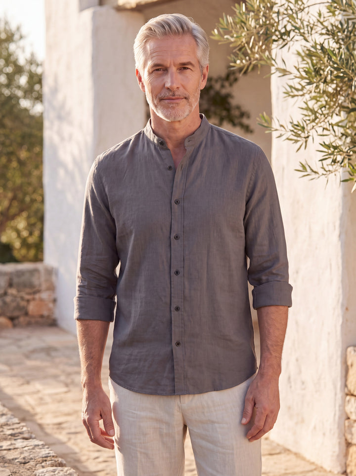 Bernard Men linen shirt in charcoal, worn by a model on a Mediterranean terrace, Gentlemens Manor lifestyle