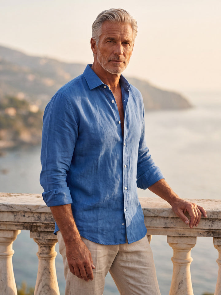 Bernard Men linen shirt in Navy, worn by a model on a Mediterranean terrace - Gentlemens Manor lifestyle