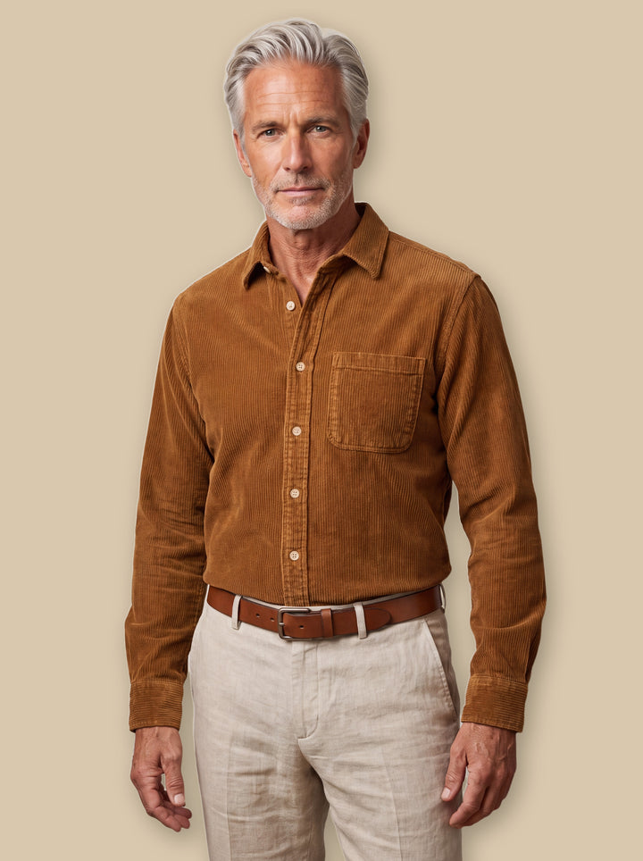 Bishop casual shirt in Brown, worn by a model on a warm sand studio background - Gentlemens Manor