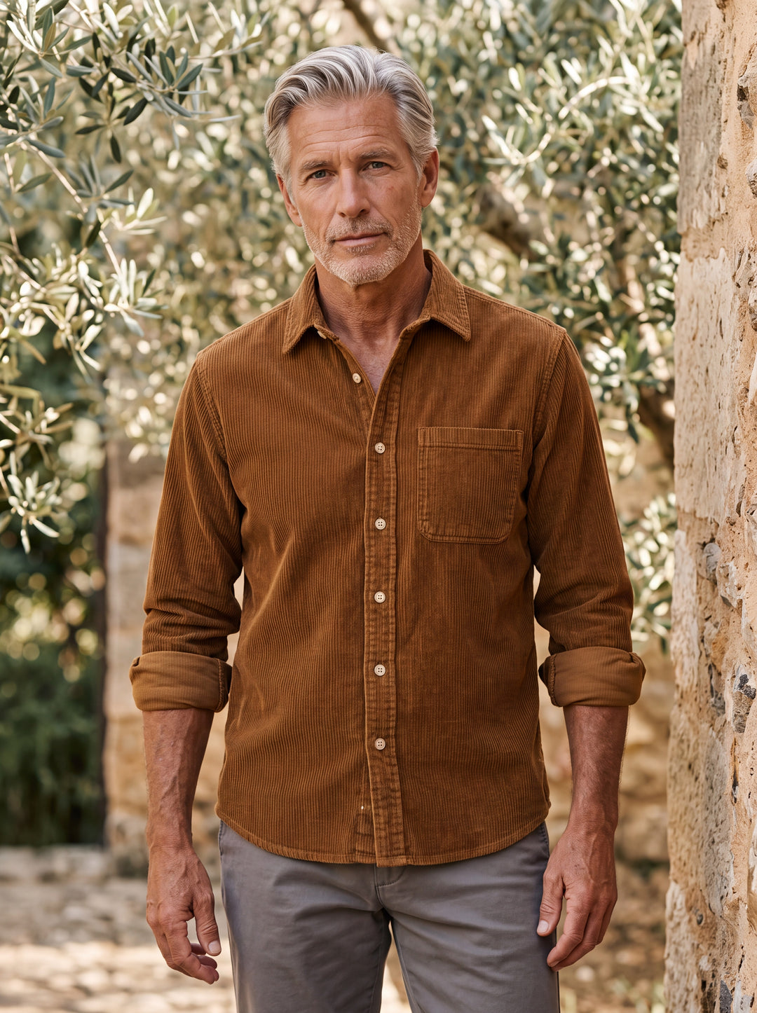 Bishop shirt in Brown, worn by a model in a Mediterranean setting - Gentlemens Manor lifestyle