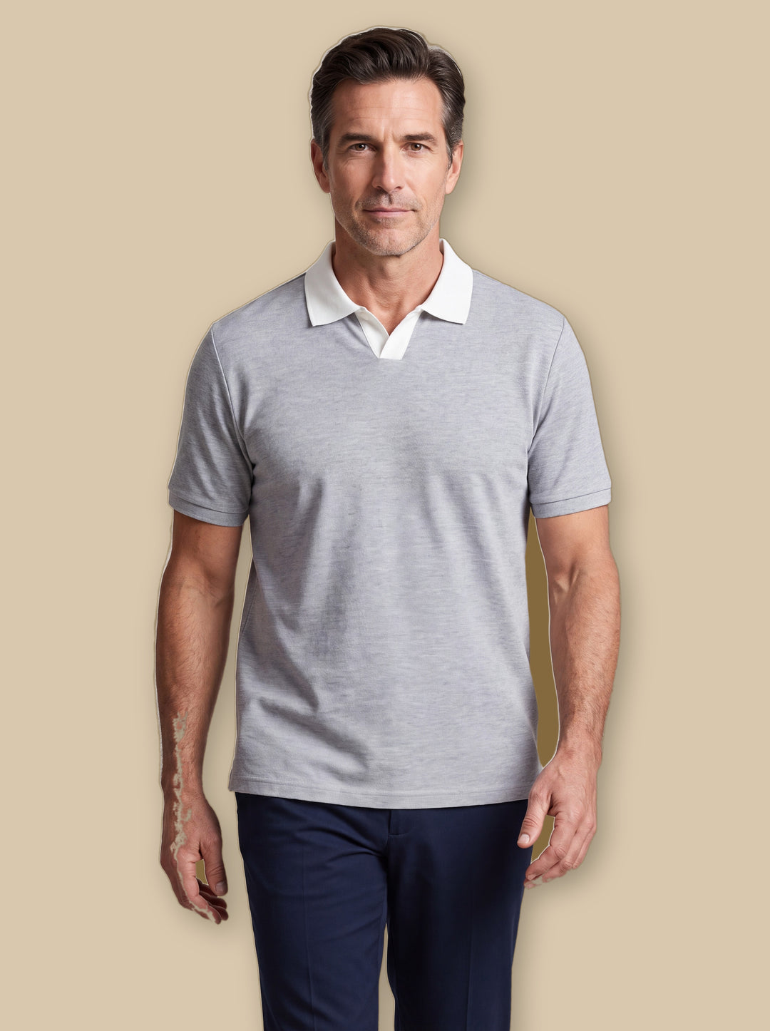 Booker polo shirt in Grey, worn by a model on a warm sand studio background - Gentlemens Manor