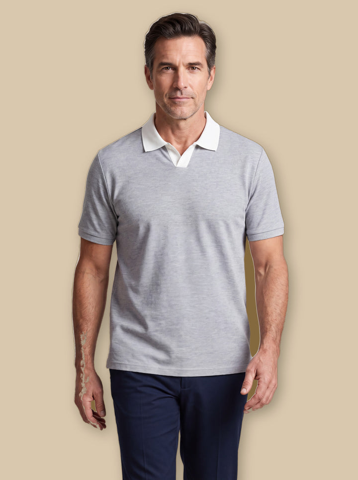 Booker polo shirt in Grey, worn by a model on a warm sand studio background - Gentlemens Manor