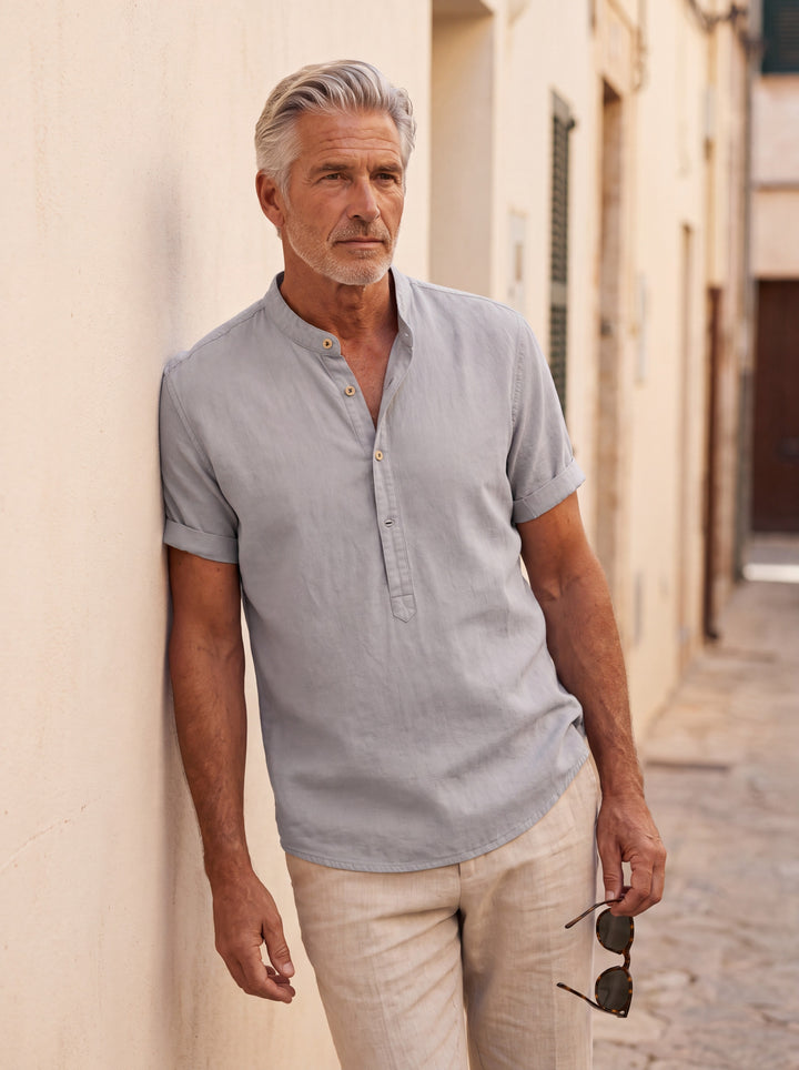 Bradford Men linen shirt in Grey, worn by a model on a Mediterranean terrace - Gentlemens Manor lifestyle