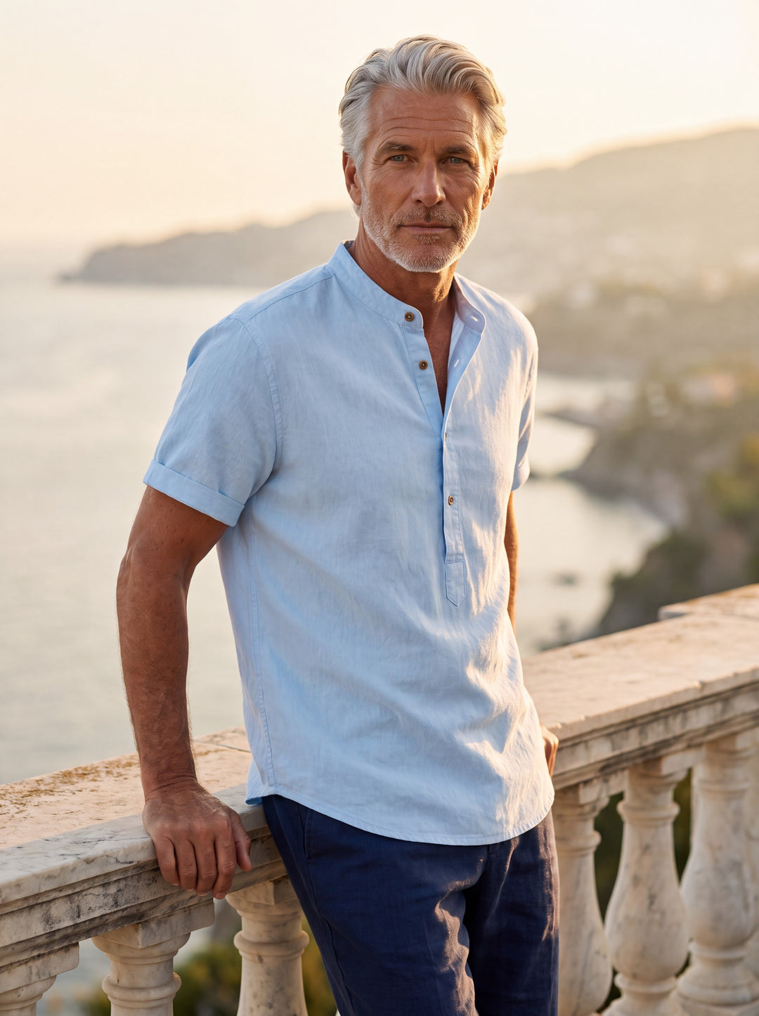 Bradford Men linen shirt in light blue, worn by a model on a Mediterranean terrace - Gentlemens Manor lifestyle