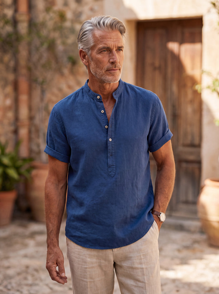 Bradford Men linen shirt in Navy, worn by a model on a Mediterranean terrace - Gentlemens Manor lifestyle