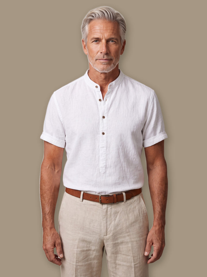 Bradford linen shirt in White, worn by a model on a warm taupe studio background - Gentlemens Manor