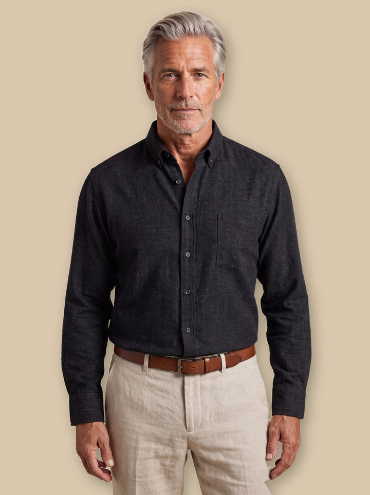 Bradley casual shirt in Black, worn by a model on a warm sand studio background - Gentlemens Manor