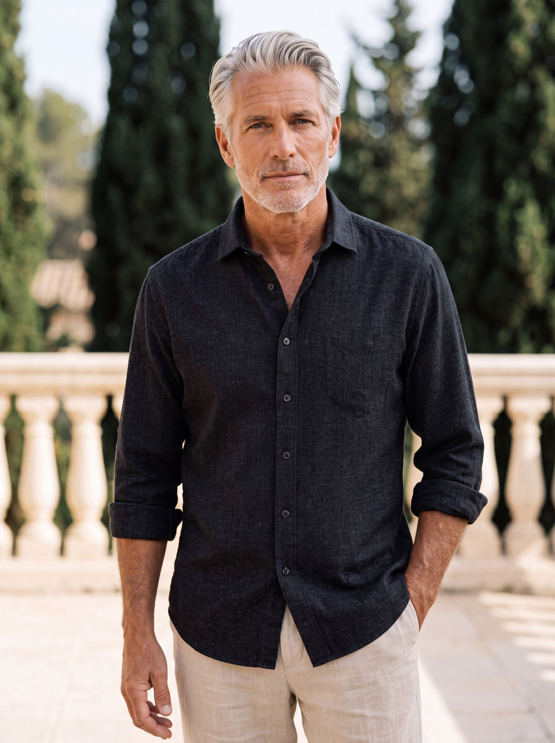Bradley shirt in Black, worn by a model in a Mediterranean setting - Gentlemens Manor lifestyle