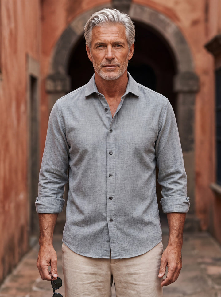 Bradley shirt in Grey, worn by a model in a Mediterranean setting - Gentlemens Manor lifestyle
