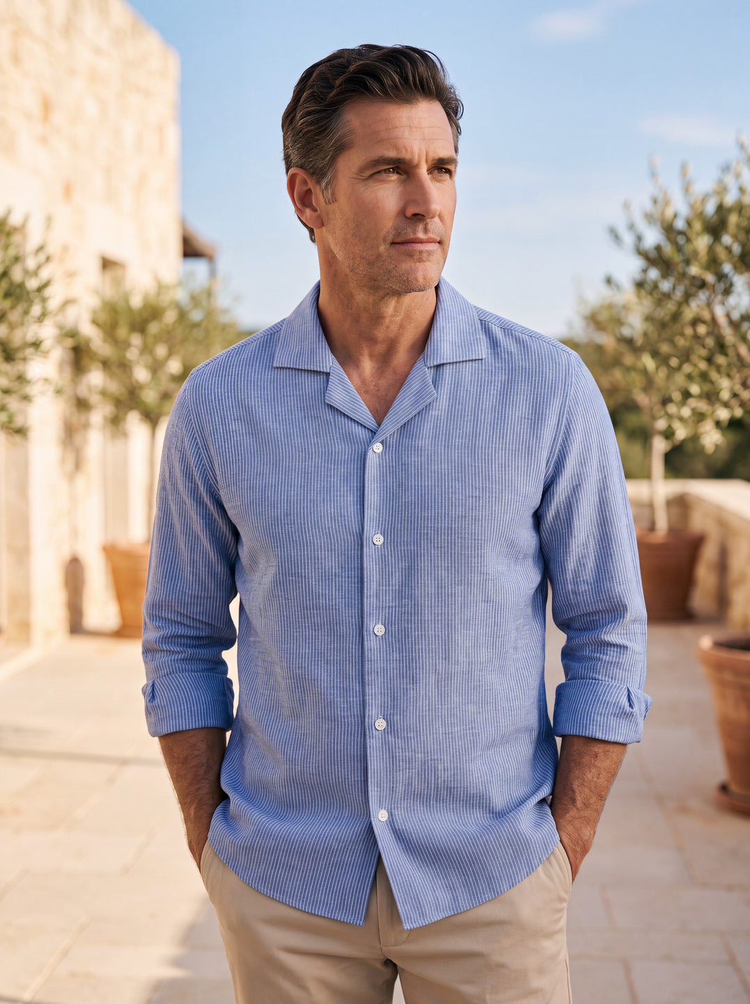Brewster shirt in Blue, worn by a model in a Mediterranean setting - Gentlemens Manor lifestyle