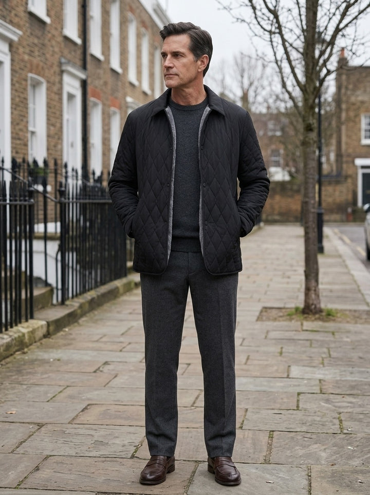 Brooks quilted shirt jacket in Black, lifestyle on a street of brick row houses, Gentlemens Manor