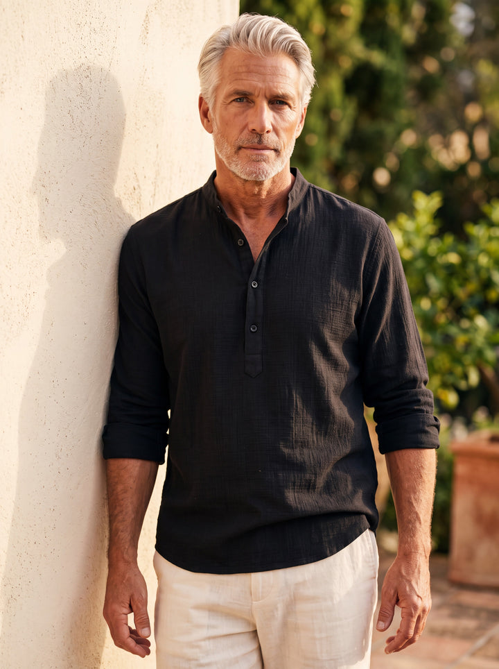 Bruce shirt in Black, worn by a model in a Mediterranean setting - Gentlemens Manor lifestyle