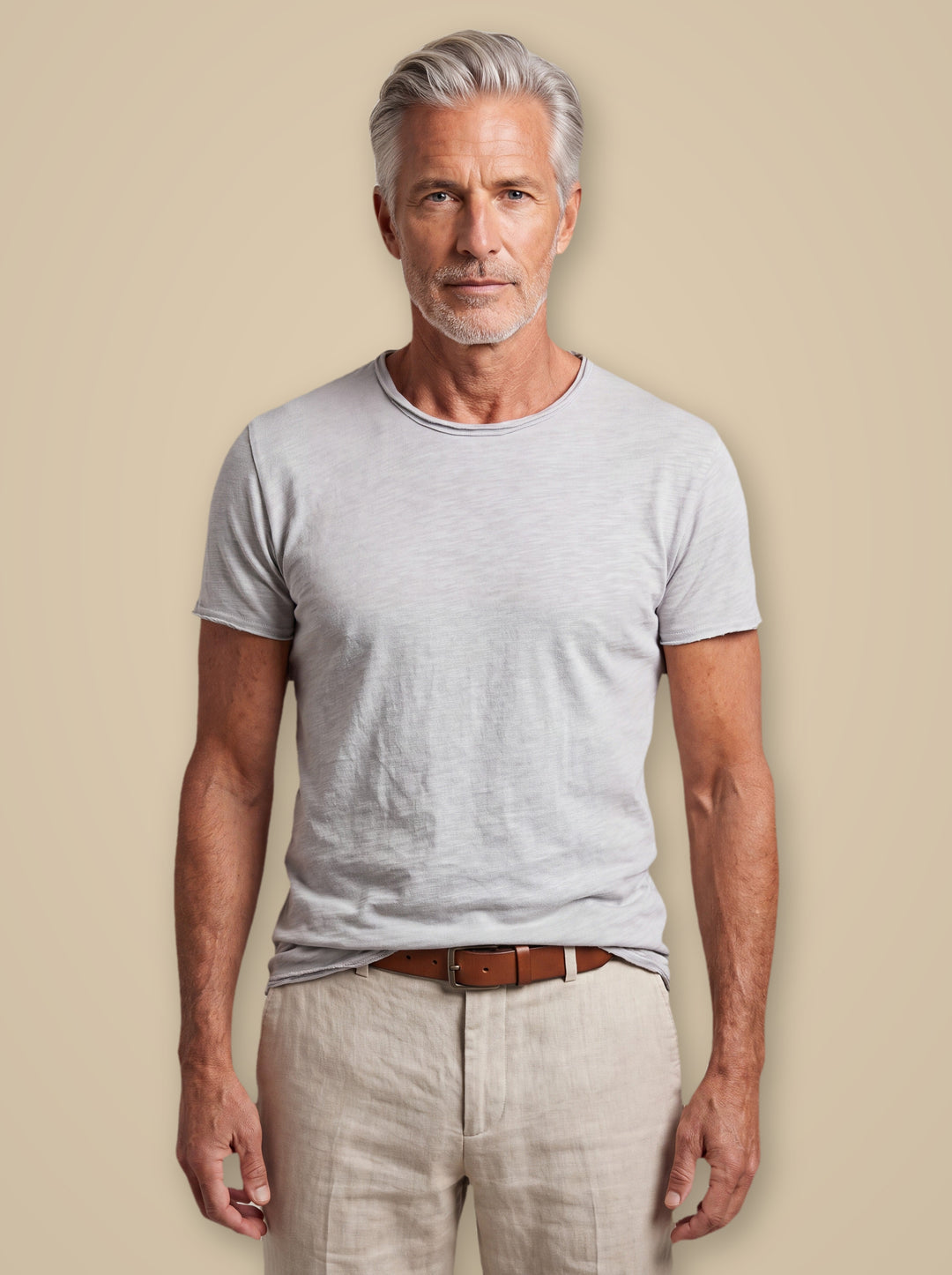 Bryce basic tee in Light Grey, worn by a model on a warm taupe studio background - Gentlemens Manor