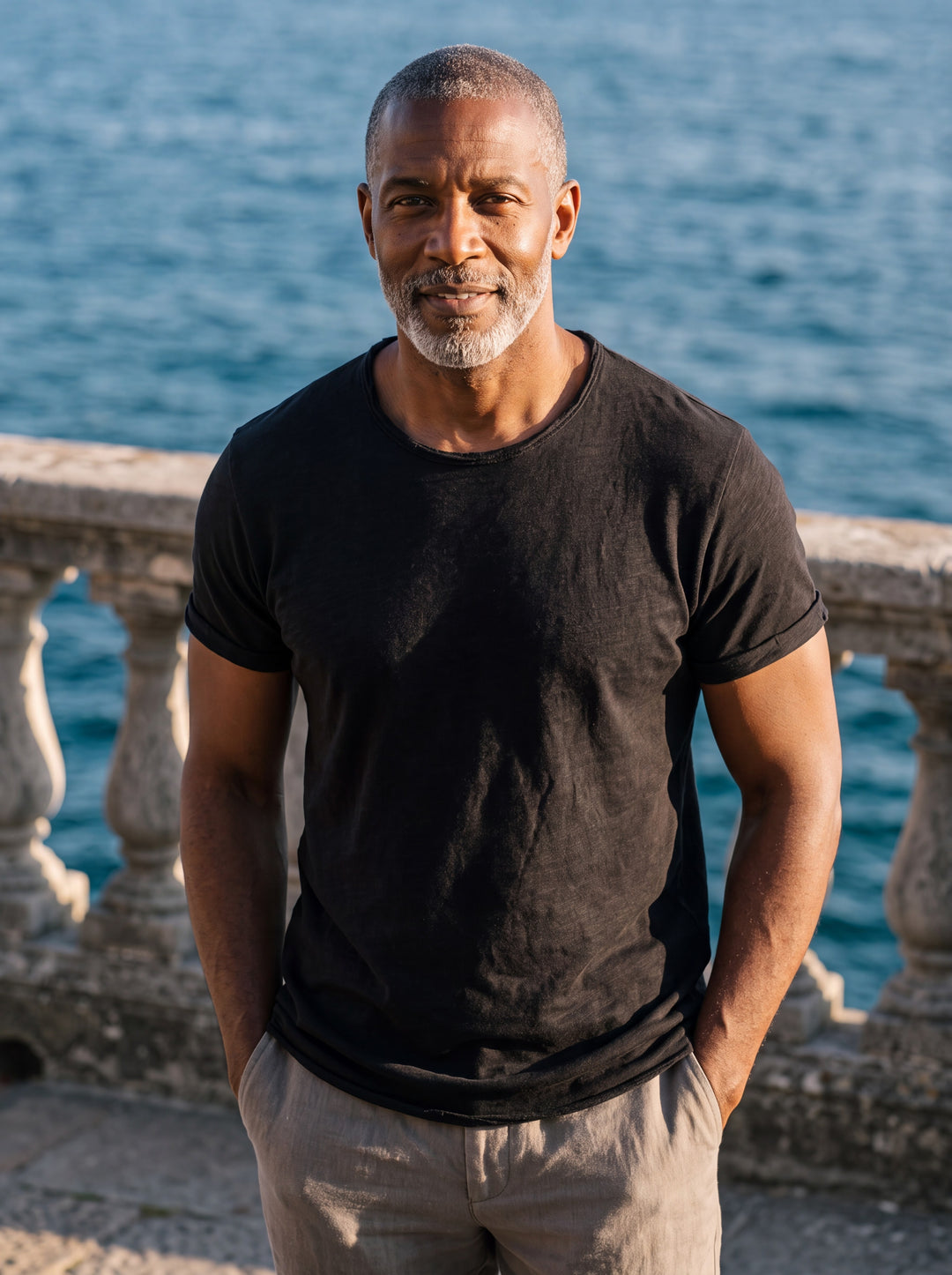 Bryce Men t-shirt in black, worn by a model on a Mediterranean terrace - Gentlemens Manor lifestyle