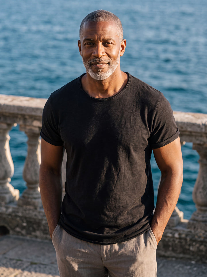Bryce Men t-shirt in black, worn by a model on a Mediterranean terrace - Gentlemens Manor lifestyle
