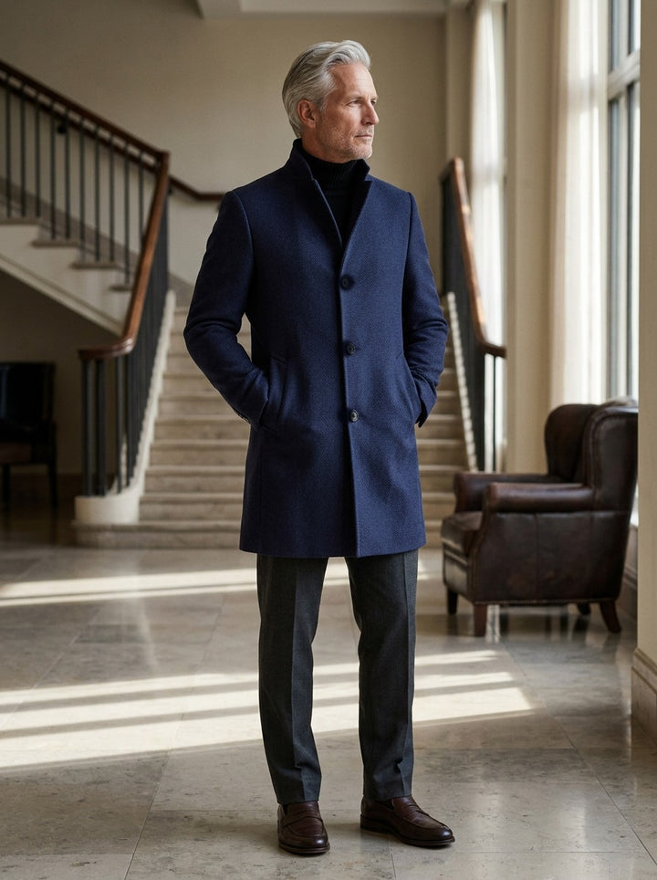 Burgess stand collar wool blend overcoat in Navy, lifestyle in a hotel lobby, Gentlemens Manor